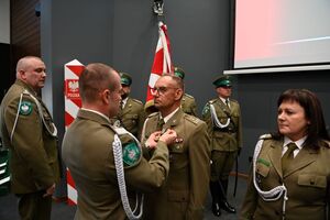 Wręczenie złotego medalu za Zasługi dla SG 